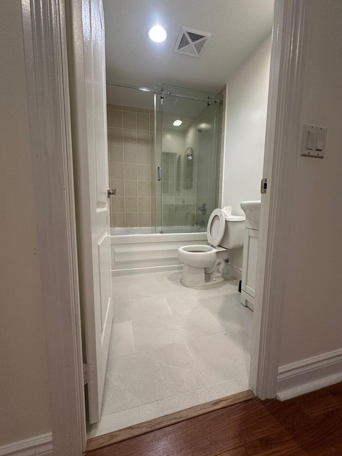 Renovated bathroom with glass shower