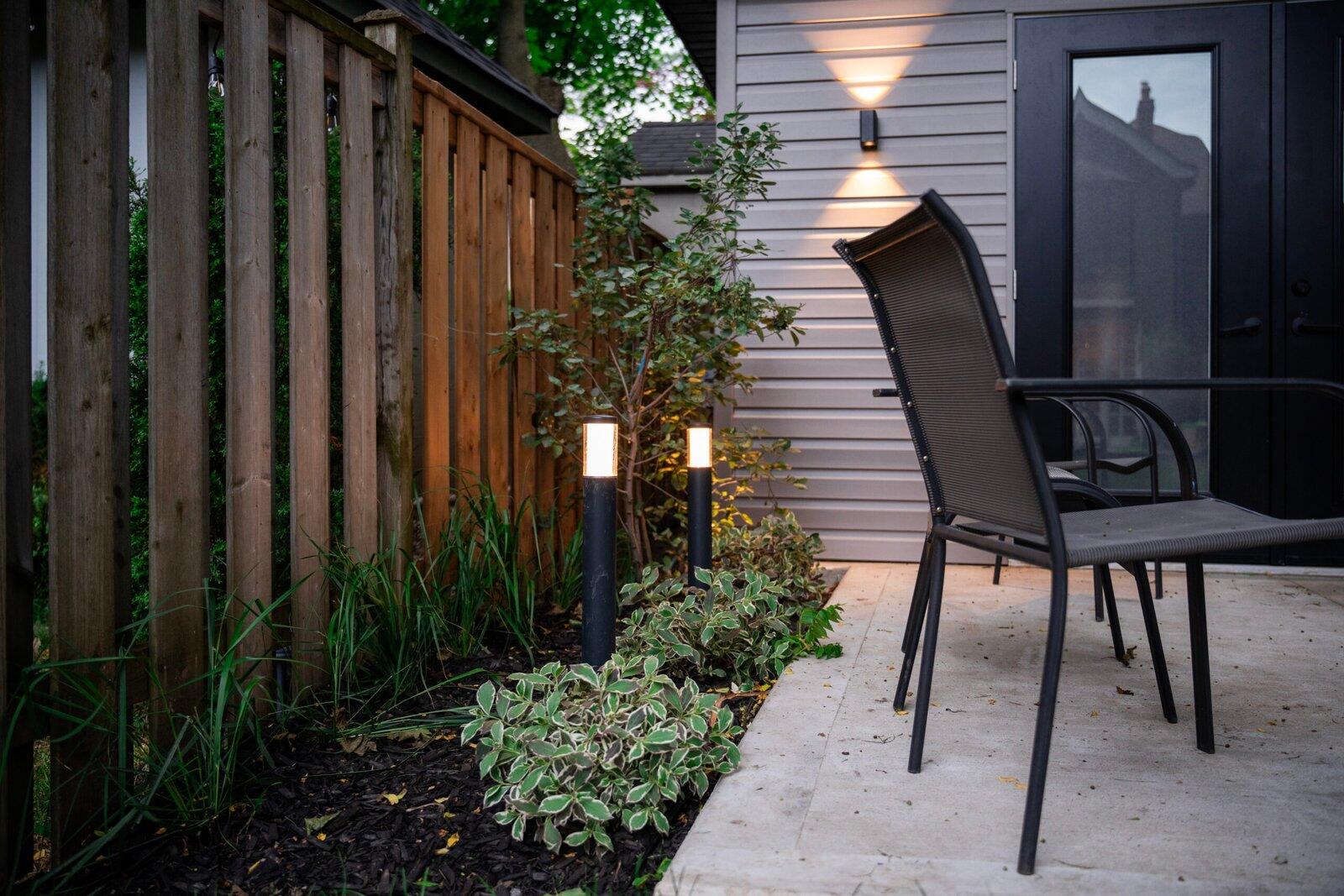 Landscape bollard and wall lighting on a patio